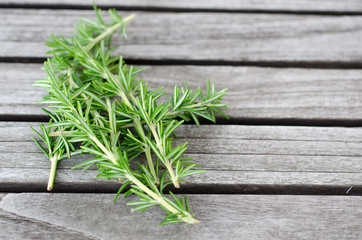 Rosemary lying on a wooden table