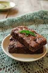 Chocolate brownie on wooden background