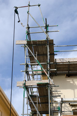 Scaffolding on the side of a residential house