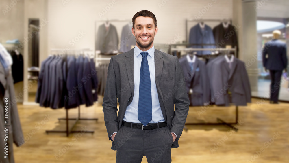 Wall mural happy young businessman over clothing store - Wall murals