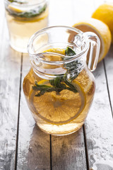 Fresh lemonade in a glass jug