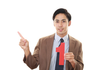 数字を持つ笑顔のビジネスマン