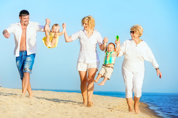 Family walking on the beach.