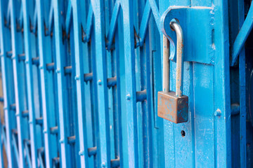 Lock key on blue door background.