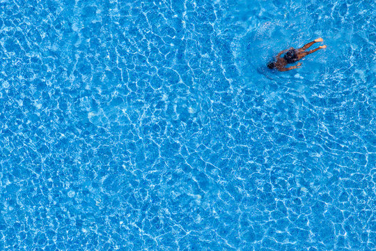 Man Swim In The Pool At The Hotel. View From Above.