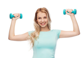 Fototapeta na wymiar smiling beautiful young sporty woman with dumbbell