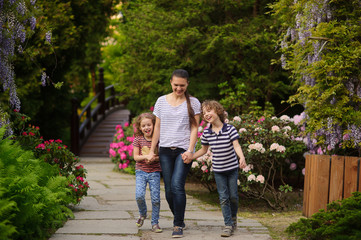 Mom with kids spending time in the park