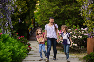 Fototapeta premium Mom spends time with children outdoors