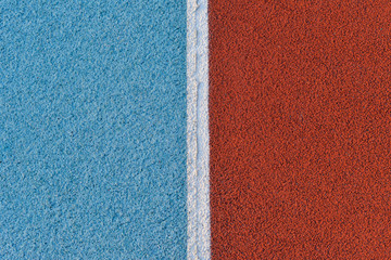 Blue and red running track rubber cover with white line