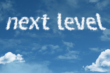 Obraz premium Next Level cloud word with a blue sky
