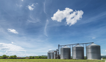Grain silo over blue sky