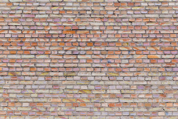 old cracked brickwork house wall