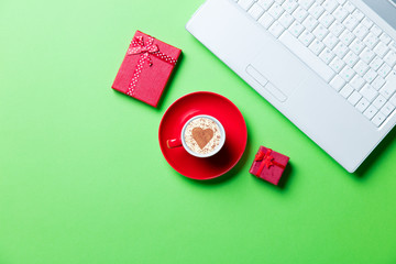 cup, gifts and laptop