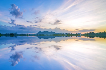 Beautiful dramatic view of nature landscape will full reflection in the morning.