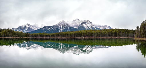 The Canadian Rockies mountains reflected in water