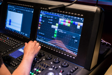 Show sound controller with operators hand