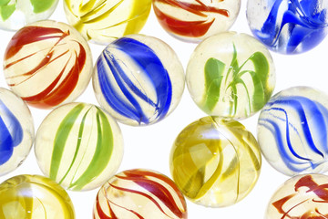 Fototapeta na wymiar Colorful glass marbles on white background