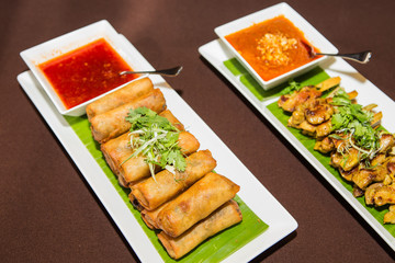 Vegetables spring roll and chicken satay