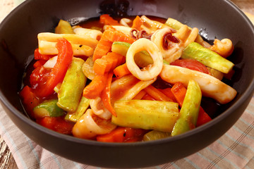 vegetable fried and squid in the black blow