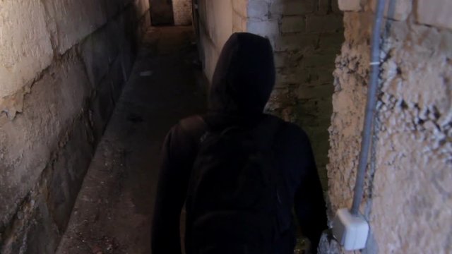 Thief in dark cellar