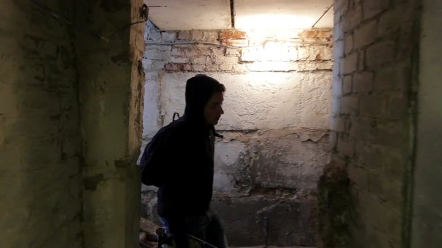 Thief in dark cellar
