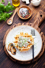 Savory waffles with mushroom creamy sauce Top view