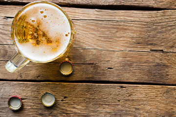 light beer mug on the wooden background