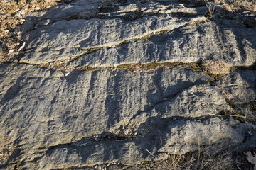 Glacial grooves in granite schist bedrock, legacy of the last ice age, in Case Mountain Park, Manchester, Connecticut.