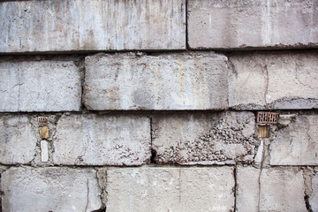 Grey wall constructed of the concrete blocks