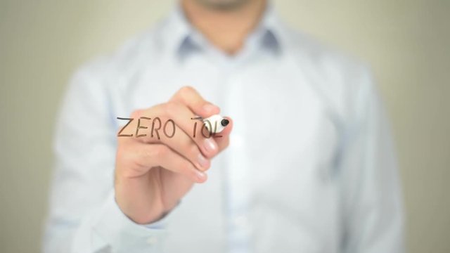 Zero Tolerance , man writing on transparent screen