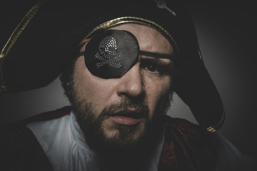 man pirate with eye patch and old hat with funny faces and expre
