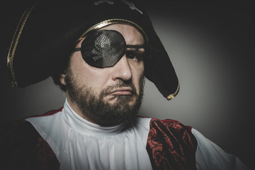 Angry man pirate with eye patch and old hat with funny faces and