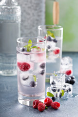 Sparkling water with berry and herb ice