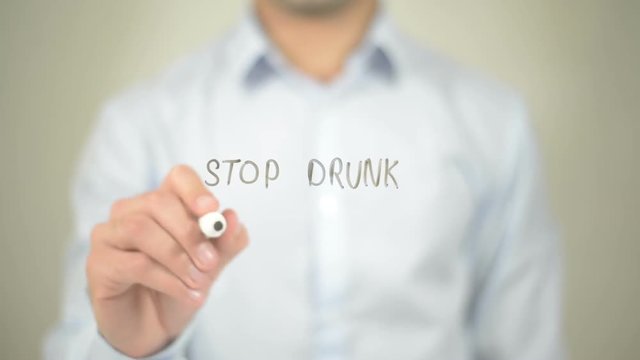 Stop Drunk Driving , man writing on transparent screen