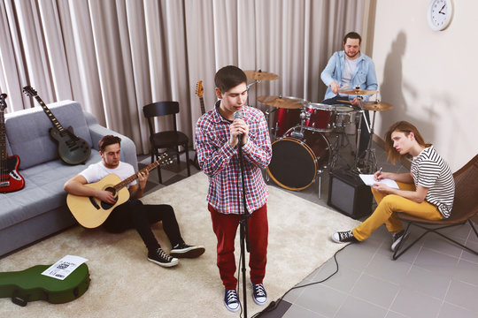 Music band performing in a recording studio