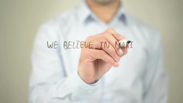 We Believe In Making A Difference , man writing on transparent screen
