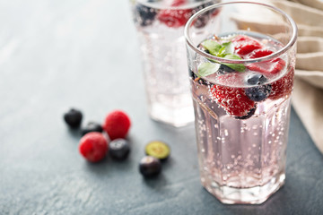 Sparkling water with raspberries and blueberries © fahrwasser
