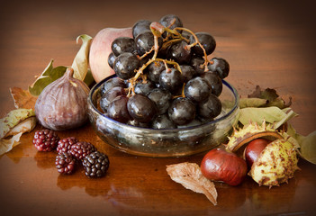 Autumnal fruits on a wooden table