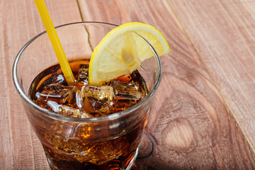 The cooling drink with ice and lemon