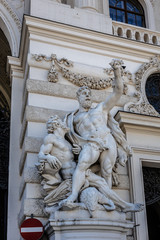 Hercules statue near entrance of Hofburg palace. Vienna, Austria