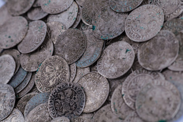 trove of ancient medieval coins silver background