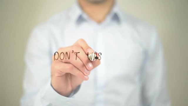 Don't Waste Time , man writing on transparent screen