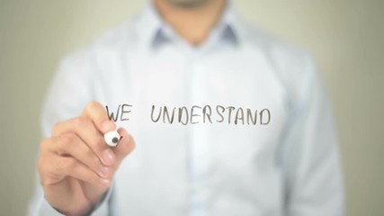 We Understand Your Needs , man writing on transparent screen