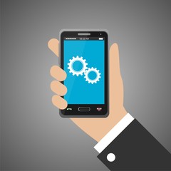 Hand holding smartphone with two gears icon