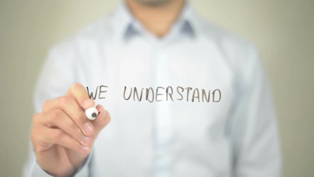 We Understand Your Needs , man writing on transparent screen