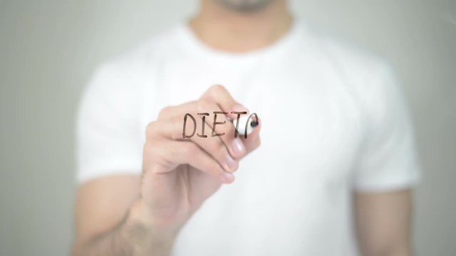 Dietary, man writing on transparent screen