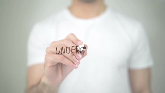 Undergraduate, man writing on transparent screen