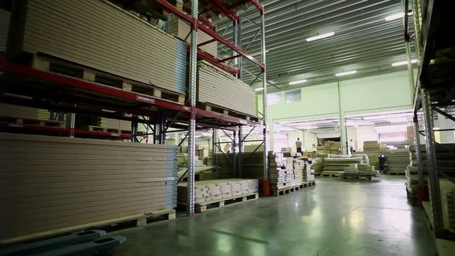 Warehouse storage of furniture. Racks with packed details of furniture.
