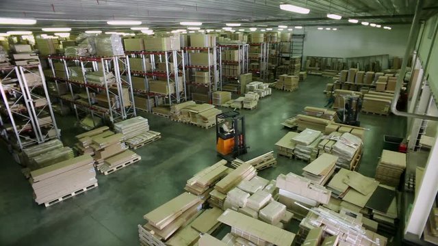 Top view of furniture warehouse storage . Racks with packed details of furniture