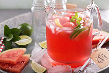 Watermelon drink with lime in a pitcher
